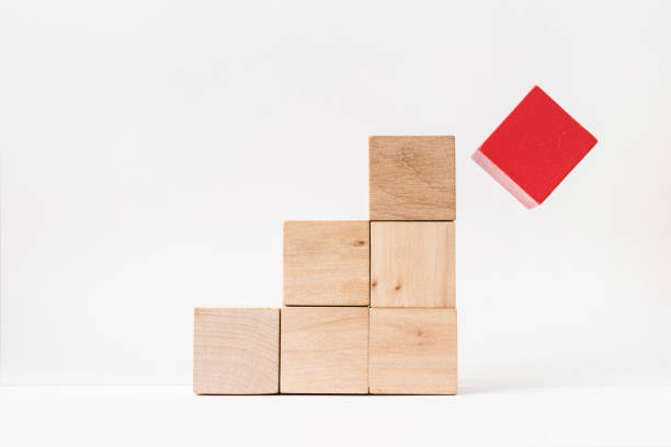 istock abstract geometric real wooden cube pyramid on white floor background 935223468