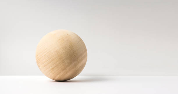 istock abstract real wooden sphere with surreal layout on white surface background 935223674