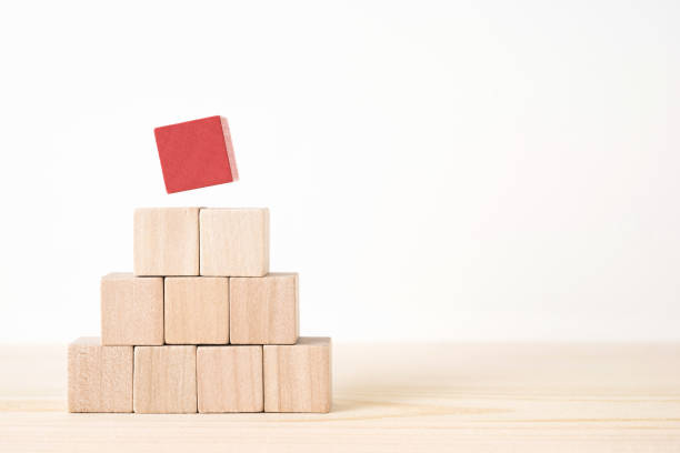 istock geometric real wooden cube with surreal layout on wood floor background 935226414