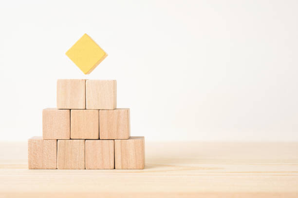 istock geometric real wooden cube with surreal layout on wood floor background 935226468