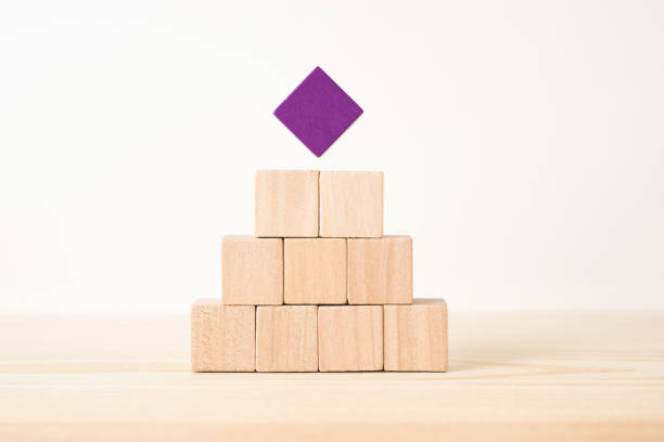 istock geometric real wooden cube with surreal layout on wood floor background 935226582