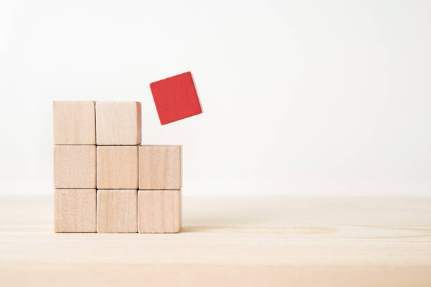 istock wooden cube with leadership, teamwork and different concepts 935226718