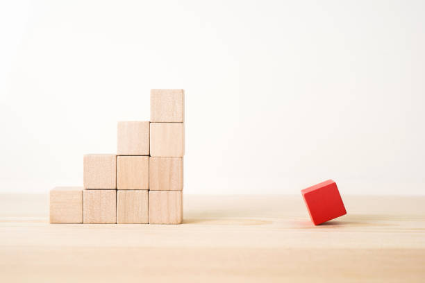 istock real wooden cube with opposite and different concept 935229338