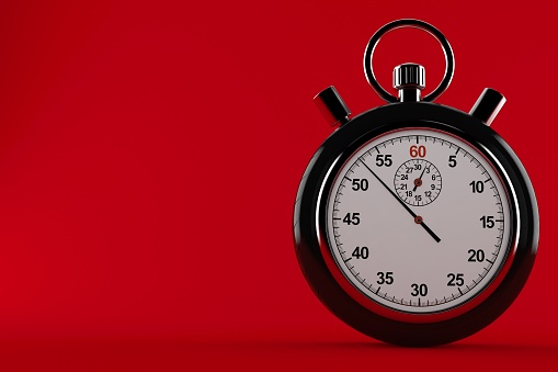 Car wheel with stopwatch isolated on red background