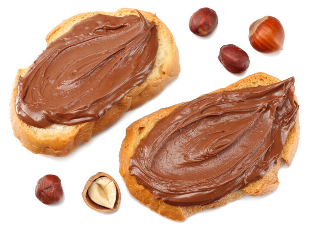 istock Slice of bread with chocolate cream with hazelnut isolated on white background 935237984