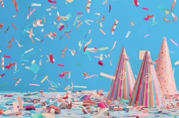 istock birthday hat and confetti  on blue background 935241868