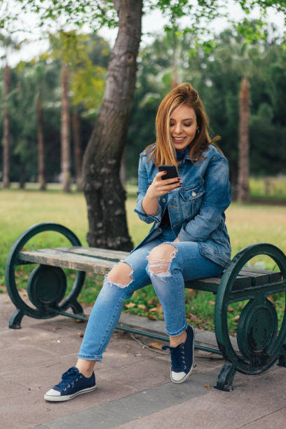 istock Young woman using smart phone 935245244