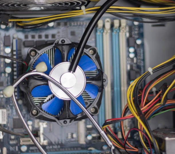 istock close-up view of blue cpu fan and stethoscope. 935245394