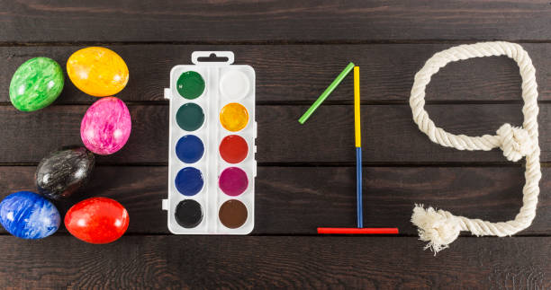 istock Formed the year: 2019 with eggs, watercolors, sticks and rope. 935245630