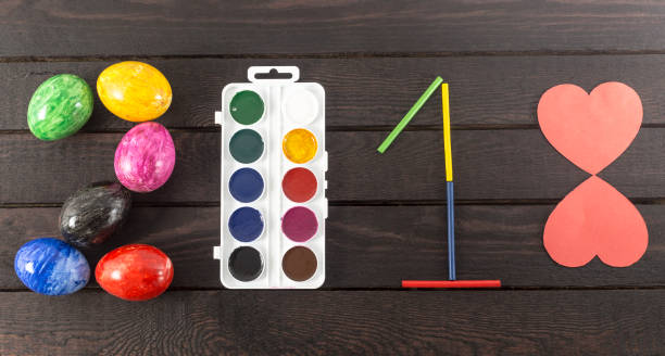 istock Formed the year: 2018 with eggs, watercolors, sticks and red paper hearts. 935245686