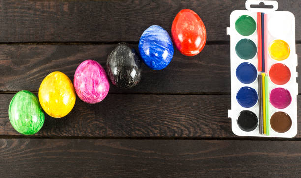 istock six colorful eggs placed like stairs on wooden background. 935245730