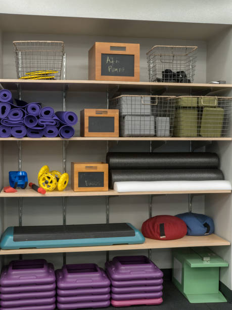 istock Shelf of work out equipment in modern gym 935245850