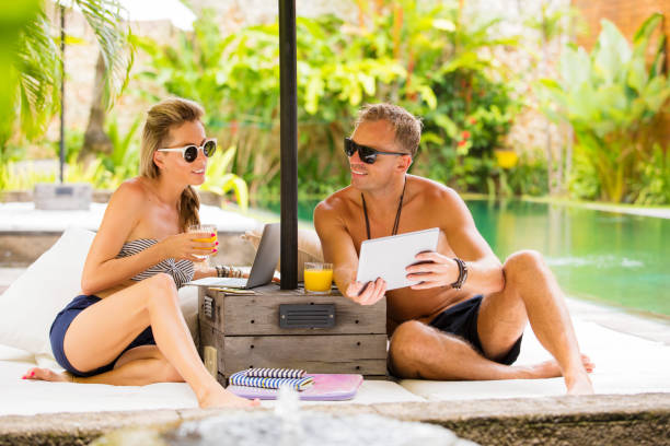 istock Young couple relaxing in luxury tropical villa 935246014
