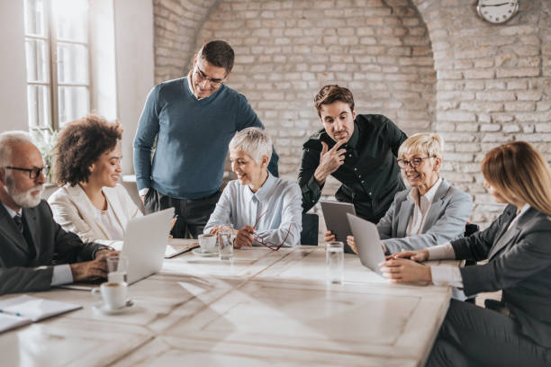 istock Multi-tasking business people working on a meeting in the office. 935261746