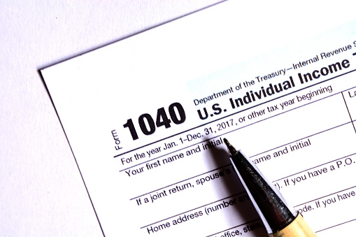 American tax form 1040 on white background. Fill-up American tax form.