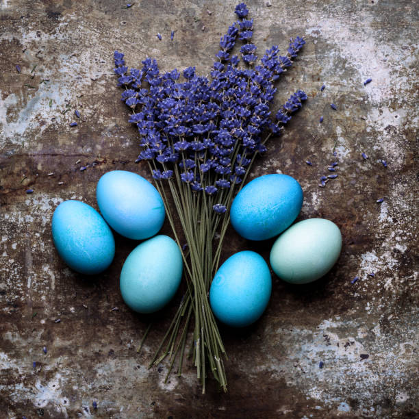 istock Happy Easter rustic concept with copy space. DIY dyed various shades of blue Easter eggs on retro rusty metal background. 935268366