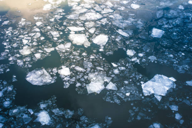 istock Broken ice on a river in the spring with a reflection of the sun 935274856