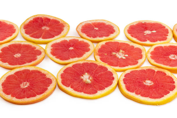 istock Round slices of the red grapefruit at selective focus 935280744