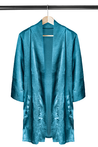 Blue silk kimono on wooden clothes rack isolated over white