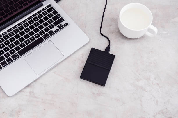 External hard drive disk connected to the laptop stock photo