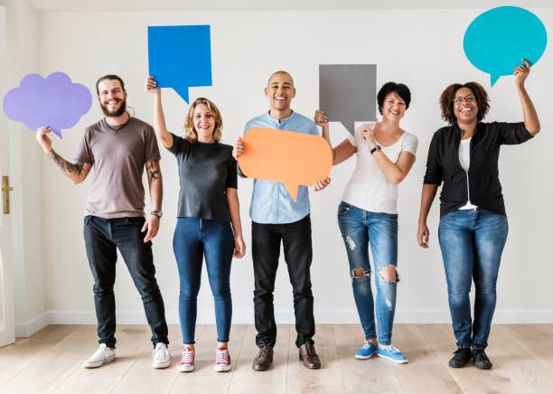 istock People carrying speech bubble icons 935288360