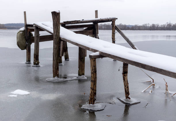 istock Handmade wooden pier on the river bank. 935294330