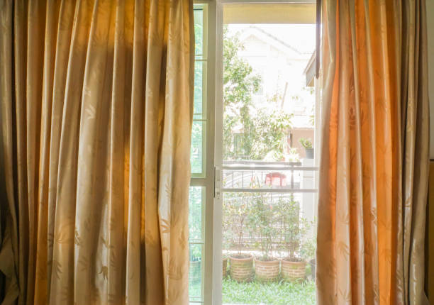 istock close up beige curtain at home sliding door 935294730