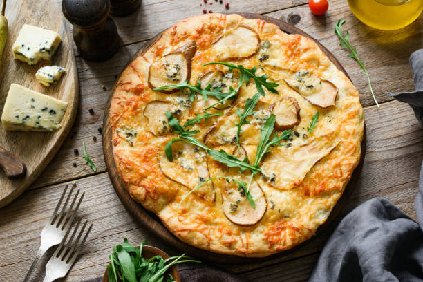 istock Quatro formaggi pizza with pear. Pear and blue cheese pizza 935296906