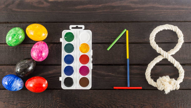 istock Formed the year: 2018 with eggs, watercolors, sticks and rope. 935297008