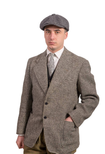 istock young man in vintage clothes with a hat, 1940 style 935297390