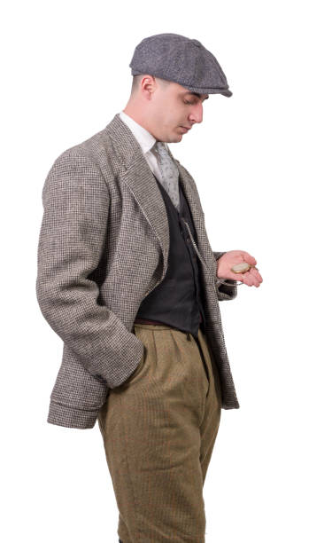 young man in vintage clothes with a hat, looking watch, 1940 young man in vintage clothes with a hat, looking watch, 1940 1940 stock pictures, royalty-free photos & images