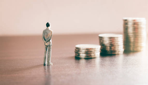 istock Miniature people looking future with stack coin about financial and money savings concept. 935297900