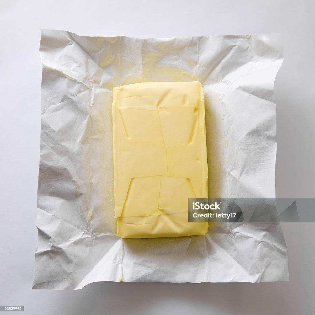 butter butter in foil from above Butter Stock Photo
