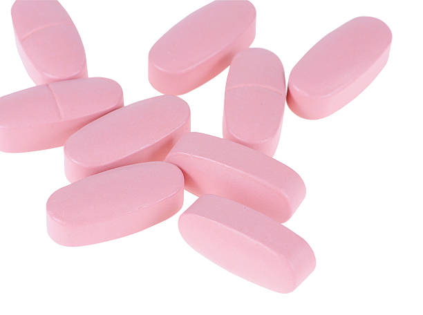 tablets - pink pill stock-fotos und bilder