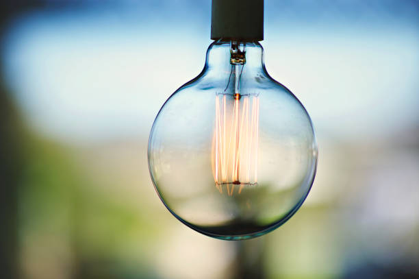 istock Close Up of Shining Modern Light Bulb 935304628