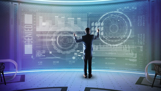 istock Calm programmer standing in front of a large screen with his hands up 935305038