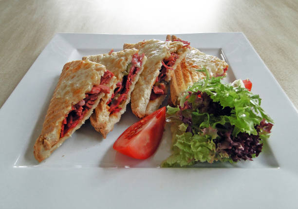 istock Toasted, cheddar cheese and sausage sandwich toast ... 935307952