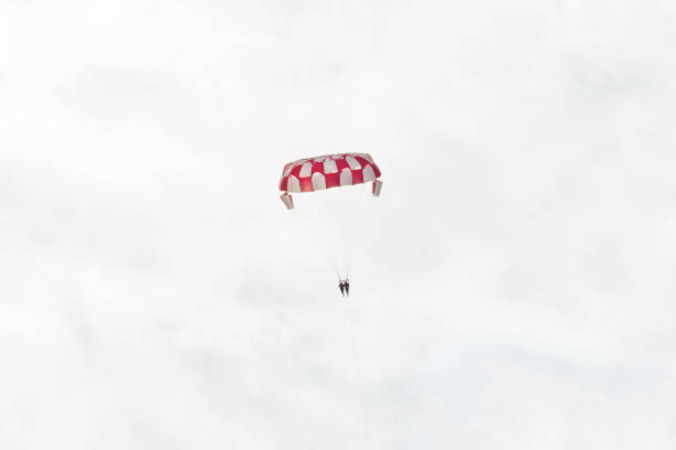high parasailing in the sky with clouds, summer
