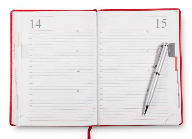 Red open diary with pen stock photo