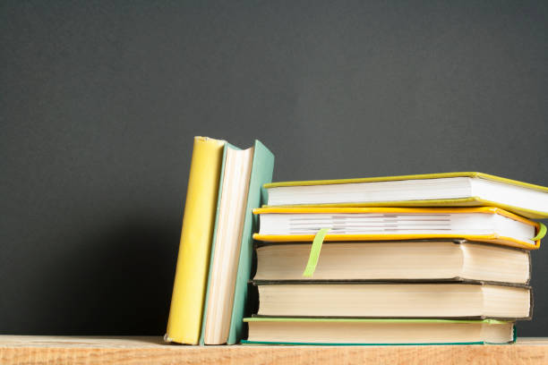 istock Stack of books on the wooden table. Education background.Back to school. Copy space for text. 935308410