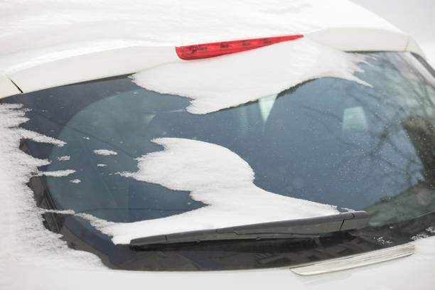 istock Snowdrifts on a winter day. Back car window in a snow. 935308610