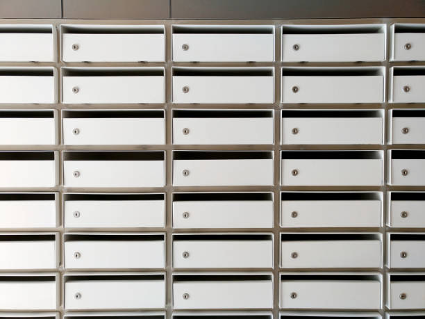 istock mail boxes or lockers for many people in the same living area, no name or tag, empty box with key holes 935311058