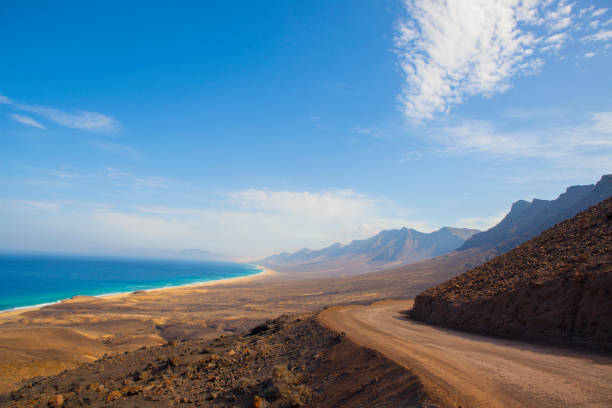 Cofete mountains clear day with the dirt road, Fuerteventura stock photo