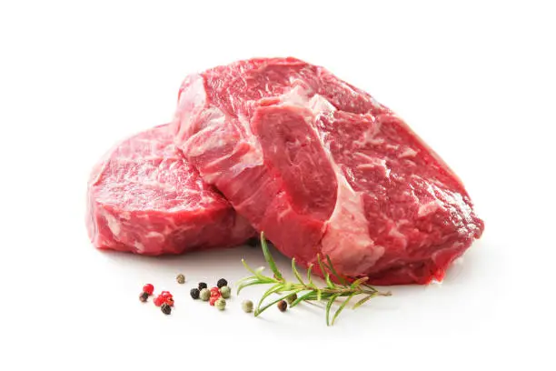 Photo of fresh raw rib eye steaks isolated on white