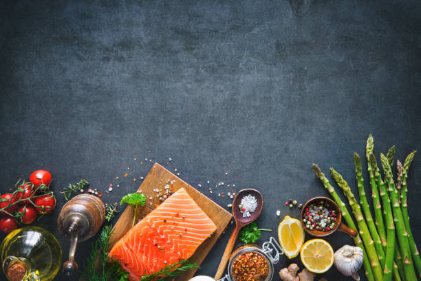 Fresh salmon fillet with aromatic herbs, spices and vegetables