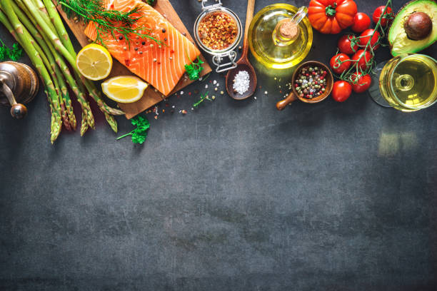 istock Fresh salmon fillet with aromatic herbs, spices and vegetables 935316730