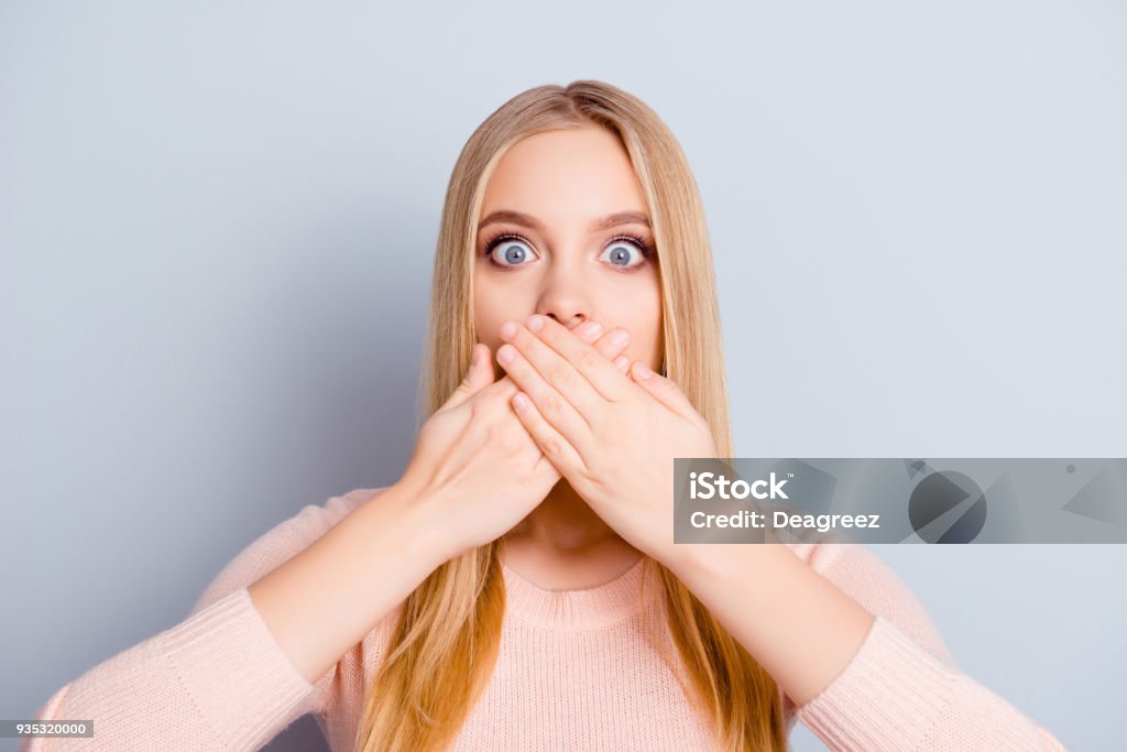 Discuss palm privacy chatter communication person lifestyle message concept. Close up portrait of charming cute innocent amazed wondered manager covering mouth with hands isolated on gray background Mouth Stock Photo