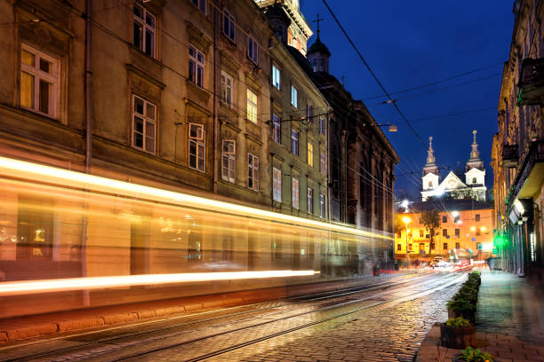 istock Street with tracks headlights 935320446