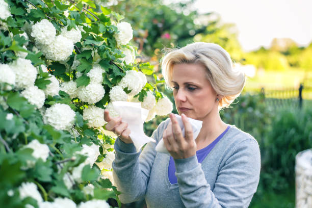 istock Woman blowing nose 935321258
