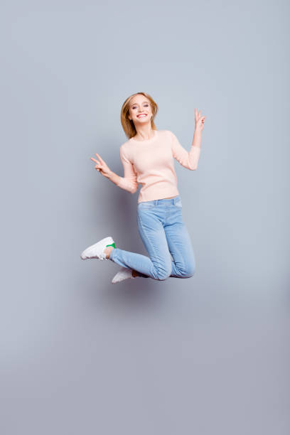 istock Sweater denim freedom freelancer win winner fun joy enjoy luck fortune come true weekend concept. Full-length vertical of cheerful careless joyful cute manager jumping up isolated on gray background 935324978